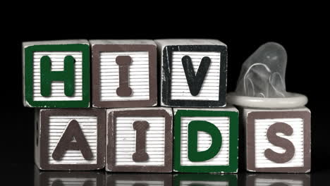 Condom-falling-on-blocks-spelling-Aids-and-Hiv