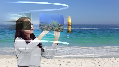 Woman-looking-at-holiday-activities-on-interactive-media-library-on-beach