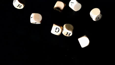 Human-rights-dice-coming-together-on-black-background