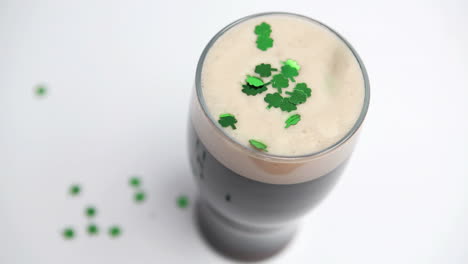 Shamrock-confetti-falling-on-pint-of-stout