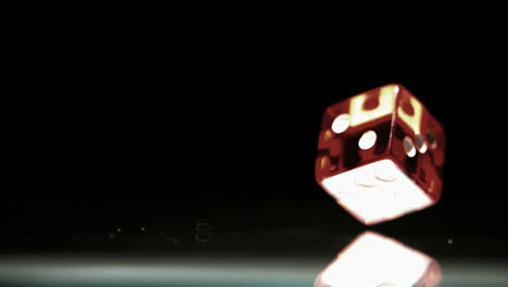 Red-dice-falling-and-bouncing-close-up