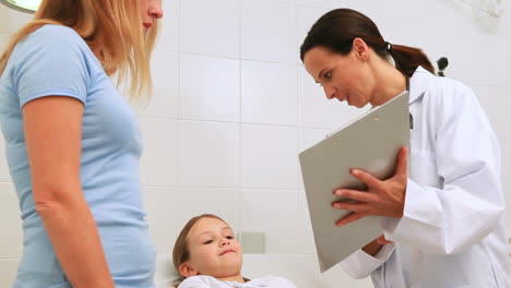 Paediatrician-examing-a-child-in-a-hospital-examination-room