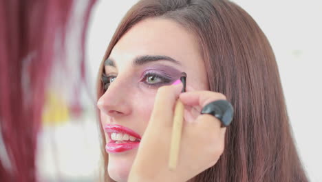 Woman-getting-eye-shadow-applied