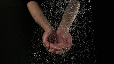 Man-washing-hands-under-water-