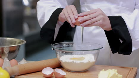 Cook-preparing-dough-in-a-kitchen