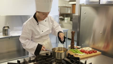 Cook-preparing-a-soup-in-a-kitchen