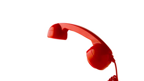 Receiver-dropping-on-red-dial-phone