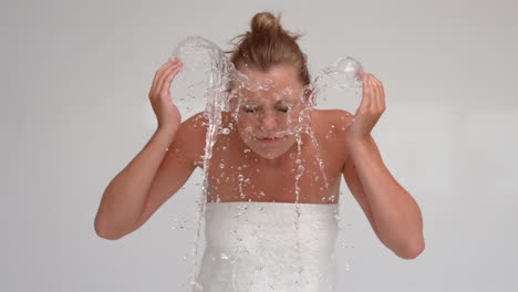 Woman-splashing-water-on-her-face