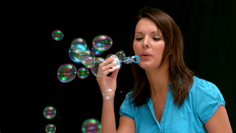 Woman-blowing-bubbles
