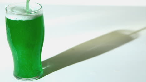 Green-beer-pouring-into-pint-glass