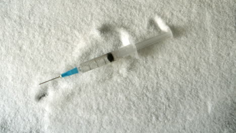 Needle-falling-into-pile-of-sugar