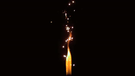 Flame-with-sparks-flying-on-black-background