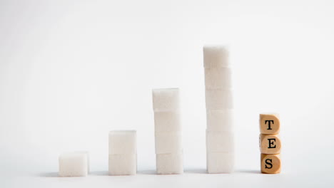 Towers-of-sugar-cubes-and-dice-spelling-diabetes-stacking-up