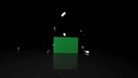 Tabletas-Cayendo-Y-Rodando-Sobre-Una-Pantalla-Verde-En-Blanco-Y-Negro