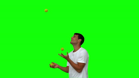 Man-dribbling-with-balls-on-green-screen