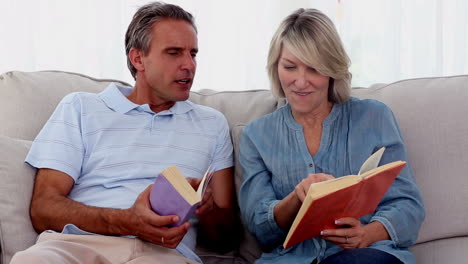 Mature-people-reading-books-on-the-couch