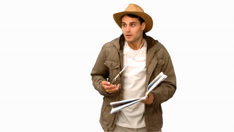 Man-with-a-map-and-a-compass-orienteering-on-white-screen