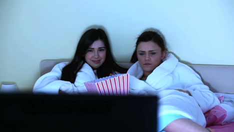 Young-women-watching-horror-movie-together