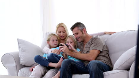 Father-taking-self-portrait-of-him-with-family