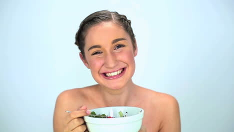 Young-woman-eating-salad