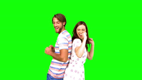 Friends-dancing-back-to-back-on-green-screen-