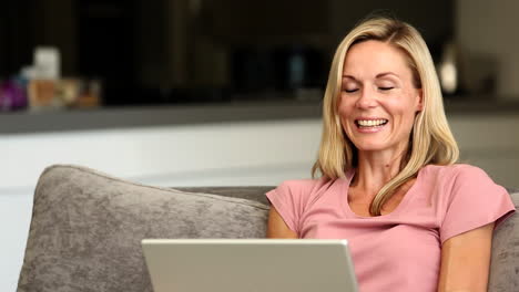 Blonde-woman-happy-winning-online