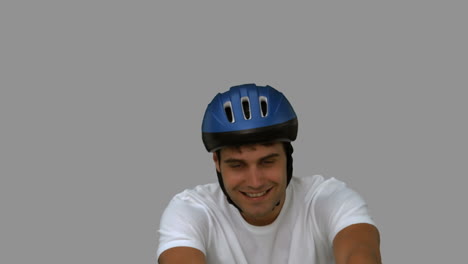 Man-on-his-bicycle-on-grey-screen