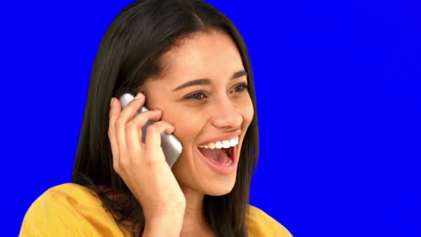 Woman-talking-on-the-phone-on-blue-screen