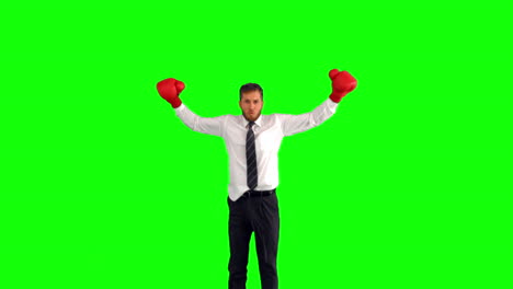 Businessman-leaping-with-boxing-gloves-and-hitting-fists-together