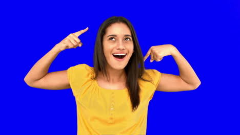 Woman-making-crazy-gesture-on-blue-screen