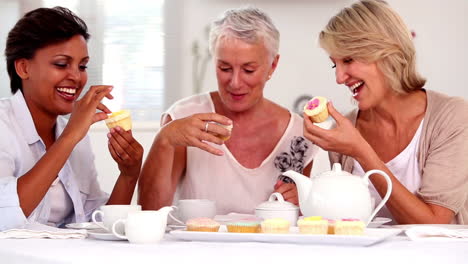 Retired-women-having-cupcakes-and-tea-together