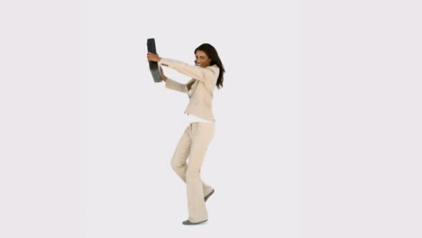 Businesswoman-jumping-and-holding-her-suitcase
