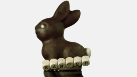 Letters-spelling-out-easter-falling-in-front-of-chocolate-bunny