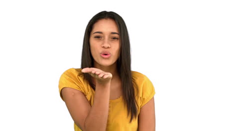 Woman-blowing-a-kiss-on-white-background