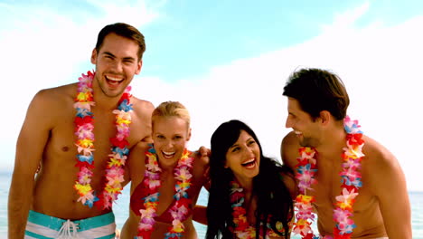 Friends-wearing-garlands-and-laughing-on-the-beach