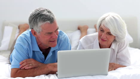 Mature-couple-using-laptop-together