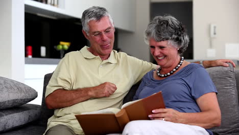 Mature-couple-looking-at-a-book-together