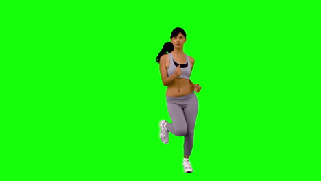 Athletic-woman-jogging-on-green-screen