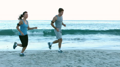 Couple-running-on-the-beach