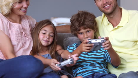 Parents-watching-their-chidren-playing-video-games