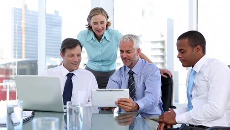 Group-of-business-people-using-laptop-and-tablet-computer