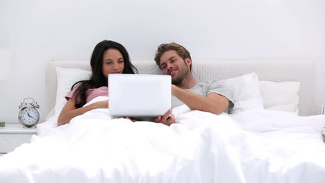 Attractive-couple-using-the-laptop-together