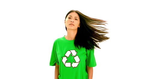 Serious-woman-wearing-green-shirt-with-recycling-symbol-on-it