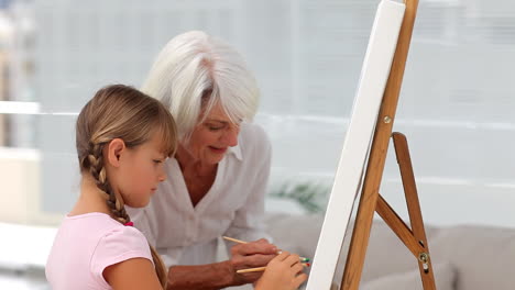 Granny-and-granddaughter-painting-together
