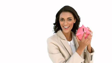 Businesswoman-catching-piggy-bank