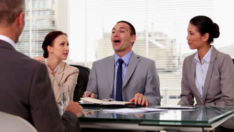 Business-people-laughing-during-a-job-interview