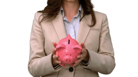 Businesswoman-throwing-a-piggy-bank-on-white-screen