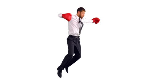Businessman-in-boxing-gloves-jumping-and-punching