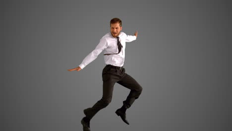 Businessman-jumping-on-grey-background