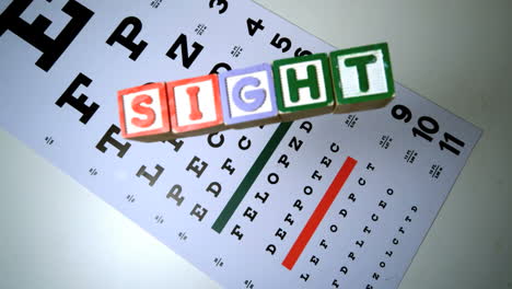 Colorful-blocks-spelling-out-sight-falling-on-eye-test